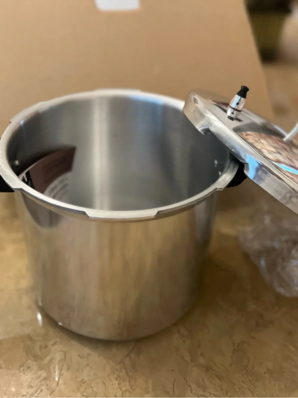 New - 6 Quart Stainless Steel Pressure Cooker with Black Handles